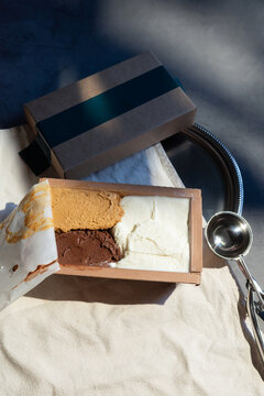 Artisanal Ice Cream Trio in Box with Scoop on Linen Cloth