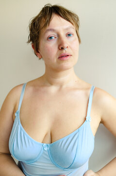 Close up portrait of curvy woman looking at camera in natural light