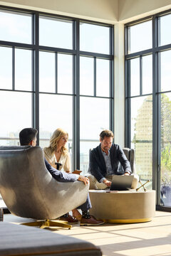 Group Meets in Modern Office Space