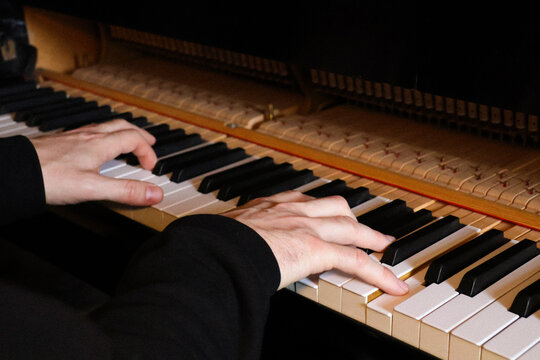 Pianist hands detail during a piano practice