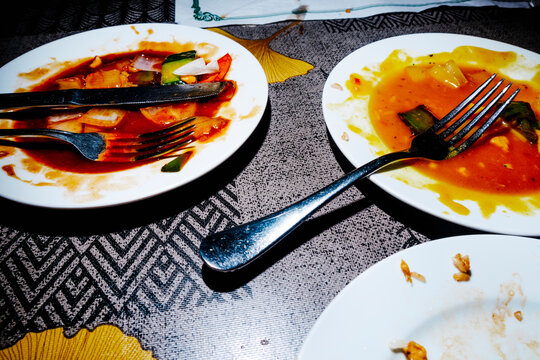 plates with leftover food after a meal in a chinese restaurant