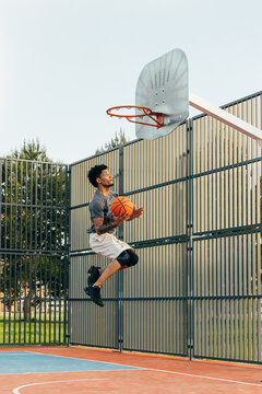 Basketball player executing a jump shot on a court