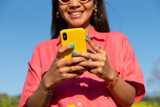 Woman texting phone outdoor lifestyle close