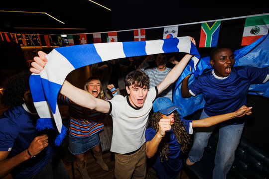 Supporters cheering for their team celebrating victory