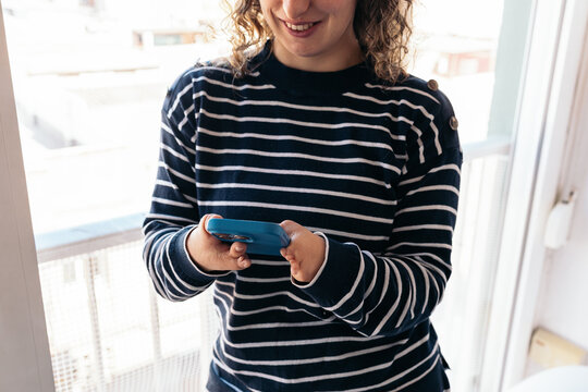 Woman with disability using smartphone for accessibility