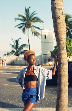 Standing by Palm Tree