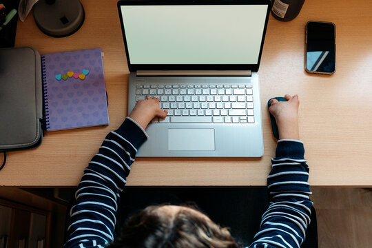 Child using laptop for inclusive remote learning