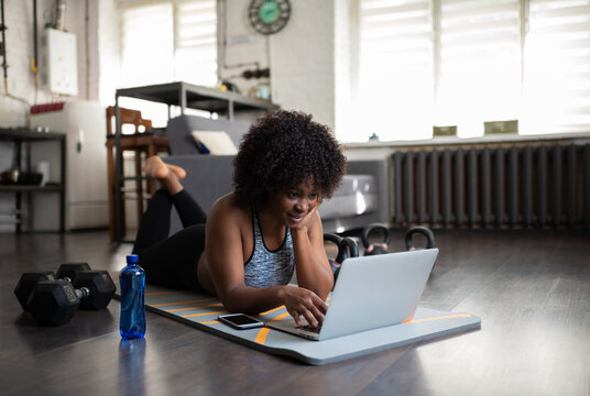 African American woman using laptop during training