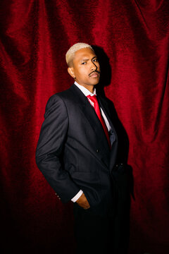 Man in suit with red tie 