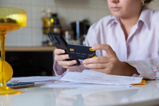 Person doing online payment with smartphone and credit card