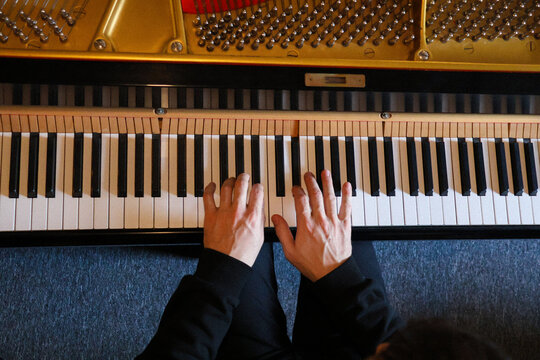 Pianist hands top view during a piano practice
