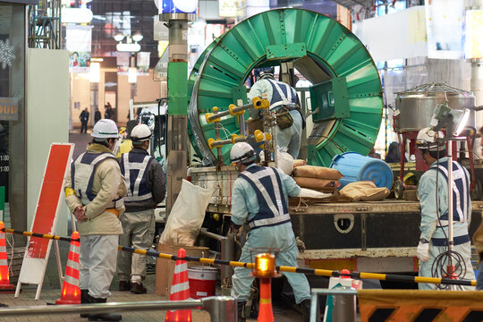 Construction Work Takes Place on a Busy Street in Tokyo 