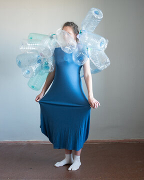 Woman full body portrait with plastic bottles 32