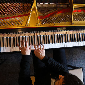 Pianist hands top view during a piano practice