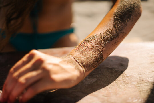 Sandy forearm in sunlight