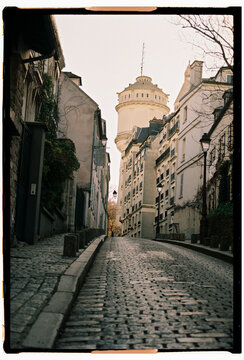 Film Photo &ndash; Cobblestone Street and Water Tower, Montmartre, Paris