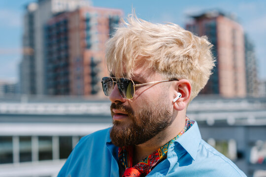 Close portrait of blond man in sunglasses