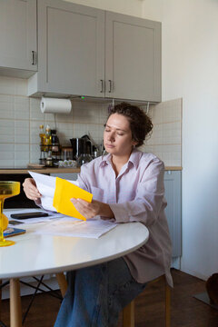 Person reviewing finances and personal budget at home