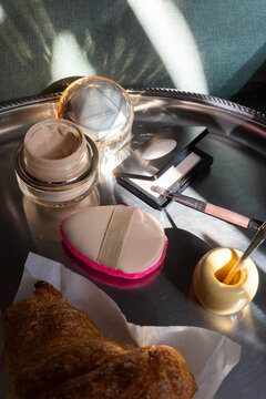 Breakfast Croissant and Beauty Essentials on Silver Tray