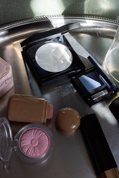 Close-Up of Makeup Products on Silver Tray