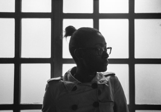 Silhouette By Window