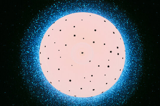 Futuristic glowing disc with particles