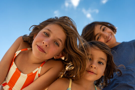 Sunlit Children Portrait by the Sea