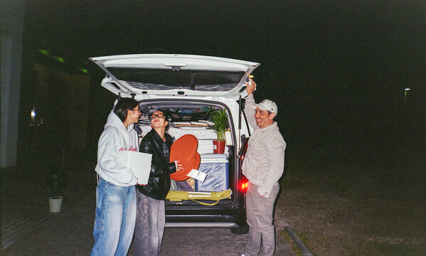 Father helps his daughter with her partner during a nighttime move
