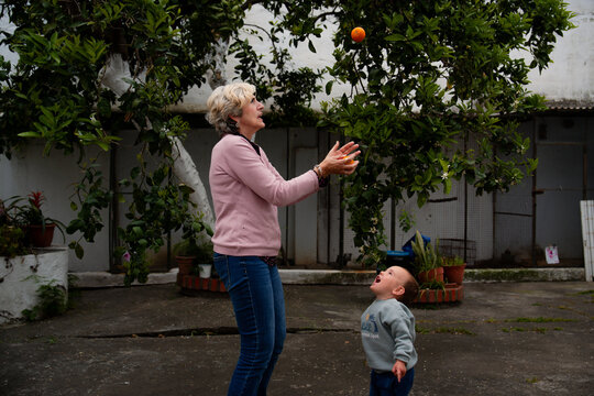 Grandmother playing with toddler