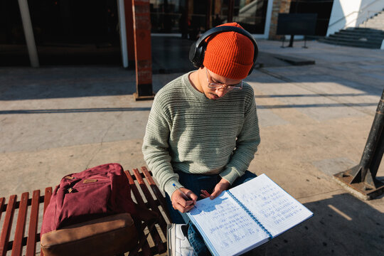 Student man studying on bench