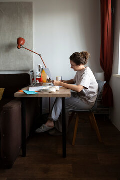 Person studying documents while working from home