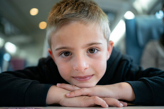 Smiling Child Resting Chin Hands