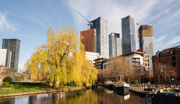 City Skyline With Tall Buildings and River in the Foreground