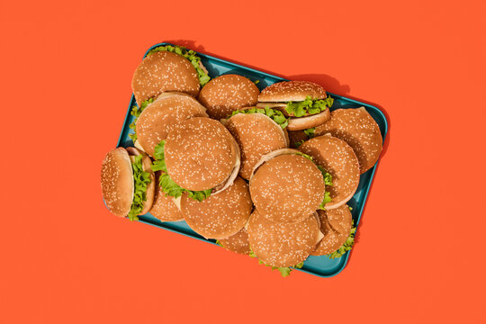 Burgers on Colorful Trays. Finger, fast food background. 