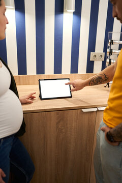 Pregnant woman and man planning dive trip