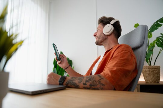 Man relaxing listening to music