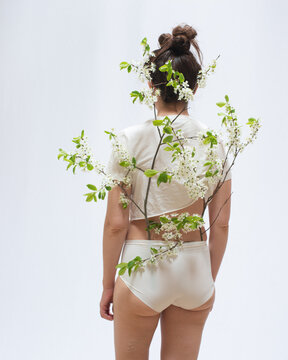 Woman standing portrait with blossom