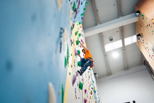Man enjoying indoor rock climbing training