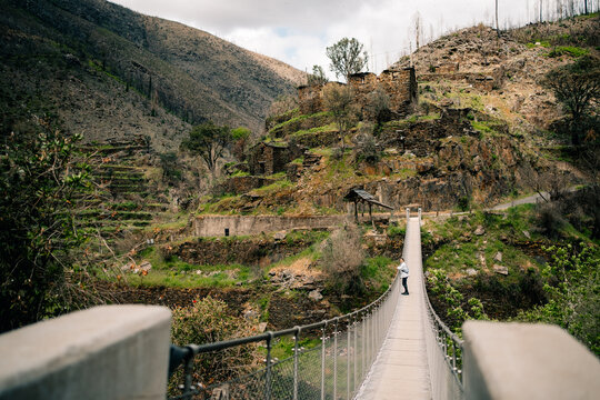 Bridge Leads to Old Ruins on a Mountain in Daylight Hours