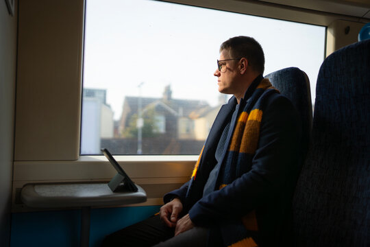 Business man commuting by train in London