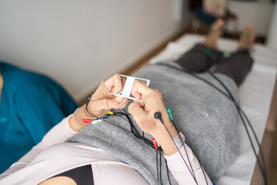Patient undergoing neurostimulation therapy at physiotherapy center