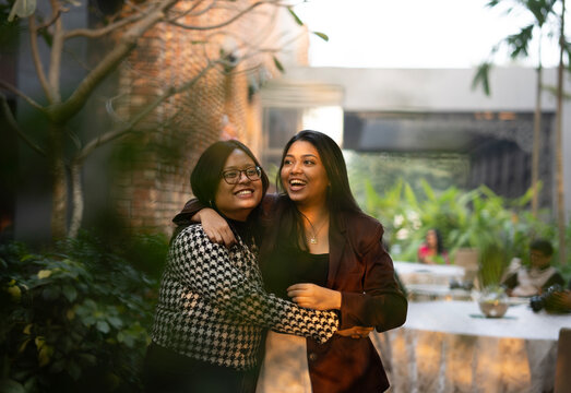 Friends interacting at outdoors looking happy and laughing