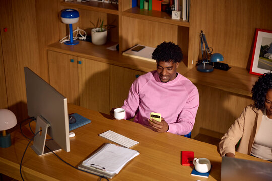 Adults sit together in a modern office setting