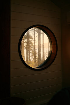 Sunrise coming through a round window