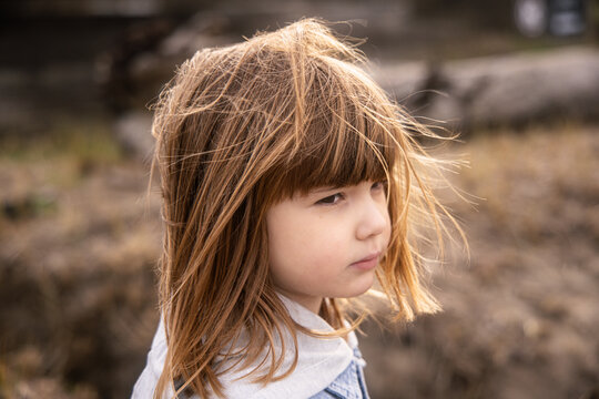 Portrait of a Girl with Her Hair Blowing in the Wind