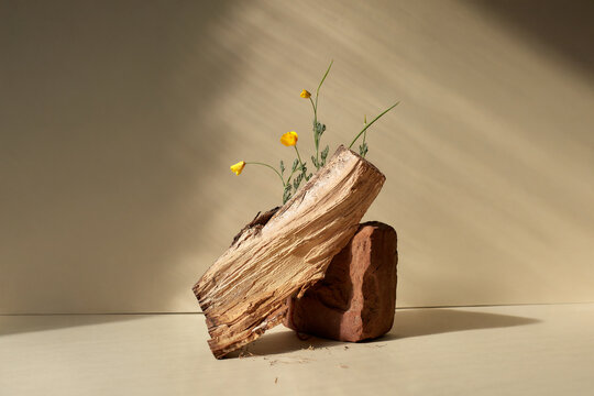 Still life with wood, old brick and flowers