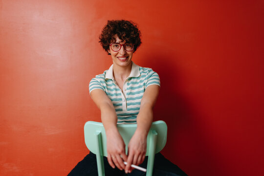 seated smiling young woman
