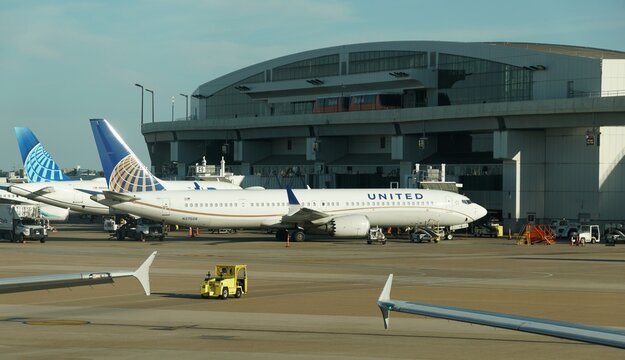 Northern Texas, U.S - May 31, 2026 - United Airlines aircraft at airport gates with ground vehicles at Dallas Fort Worth International Airport