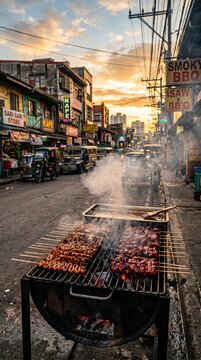 Smoky Street Bbq Grill with Isaw and Pork Skewers at Sunset