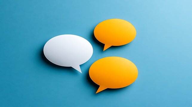Awesome photo of three oval blank speech bubbles white and orange on light blue background.